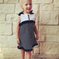 Child's Play dress sewing pattern by Whimsy Couture. This girls dress pattern has a cute partial front overlay with ruffle. It works great for all seasons.